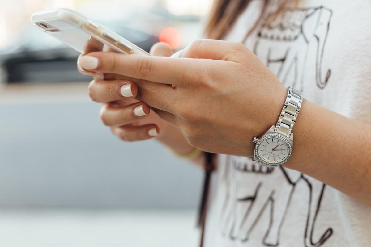 Hand holding a smartphone to check visa eligibility